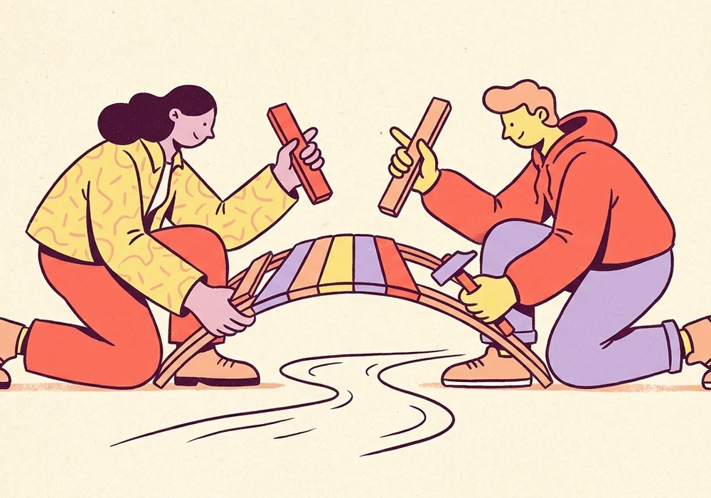 Two friends fitting colorful puzzle pieces together