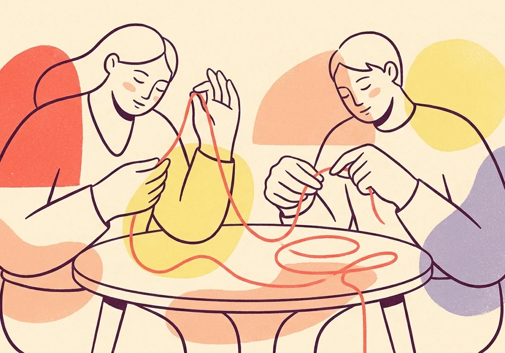 Two people calmly untangling a difficult thread in conversation