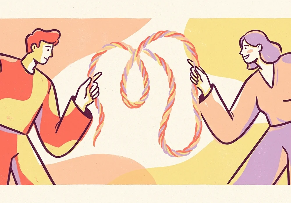 Two people gently untangling a pair of intertwined threads